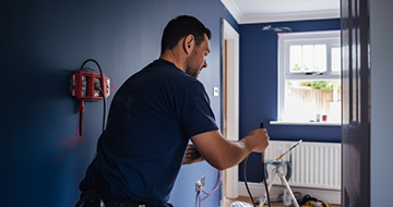 Why Choose Our Electrician Service in Woodford?