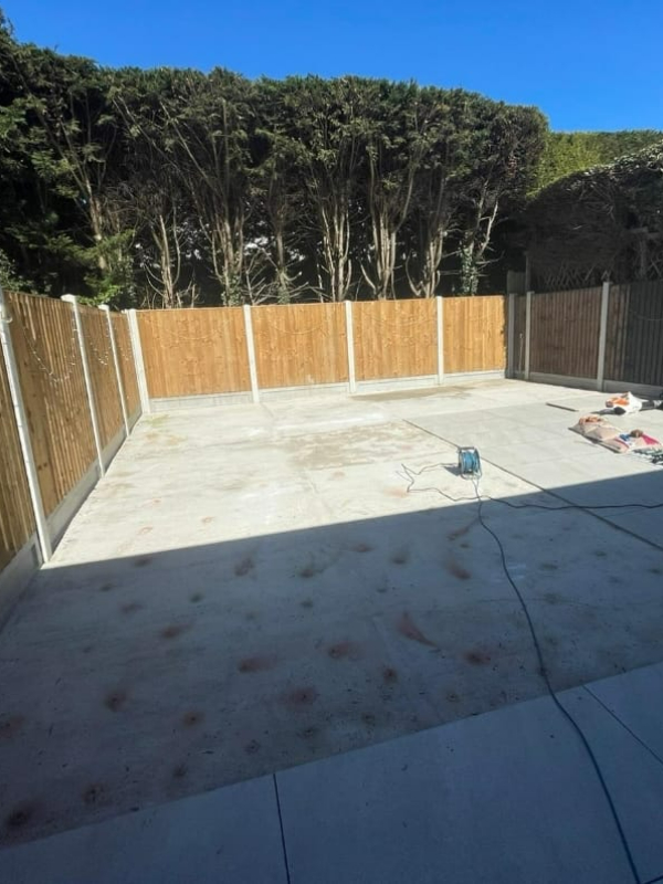 Dull, unused corner of the garden with no structure or planting design.