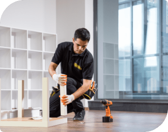 A carpenter assembling furniture