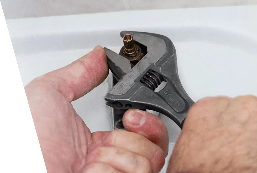 A professional's hands using a tool to fasten a bolt