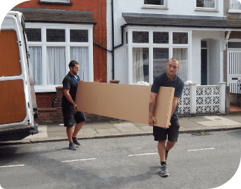 Two professional movers unloading a flat-pack from delivery van.