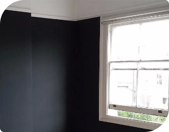 Picture of a black wall and white window