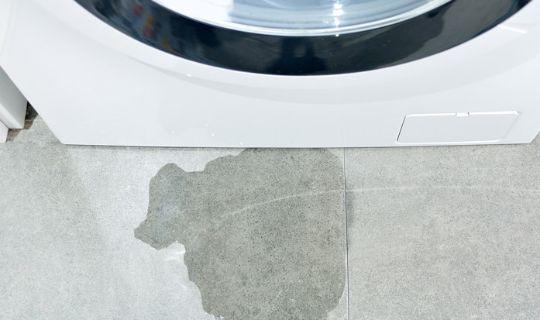 a leak on the floor from a washing machine