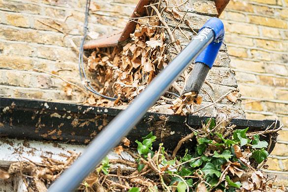 Gutter cleaner using modern equipment to check the gutters
