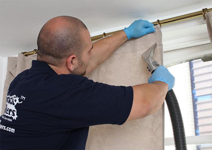 Fantastic expert cleaning a curtain