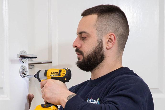 emergency locksmith drilling a lock