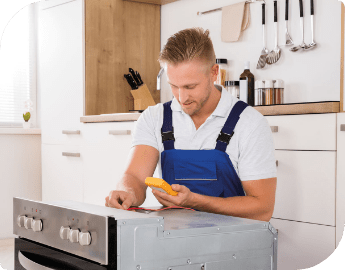 technician repairing oven