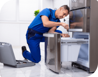 Repair specialist fixing a washing machine