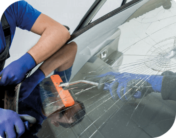 Qualified technician during windscreen replacement service