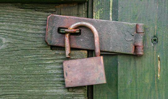 a secured wooden shed door