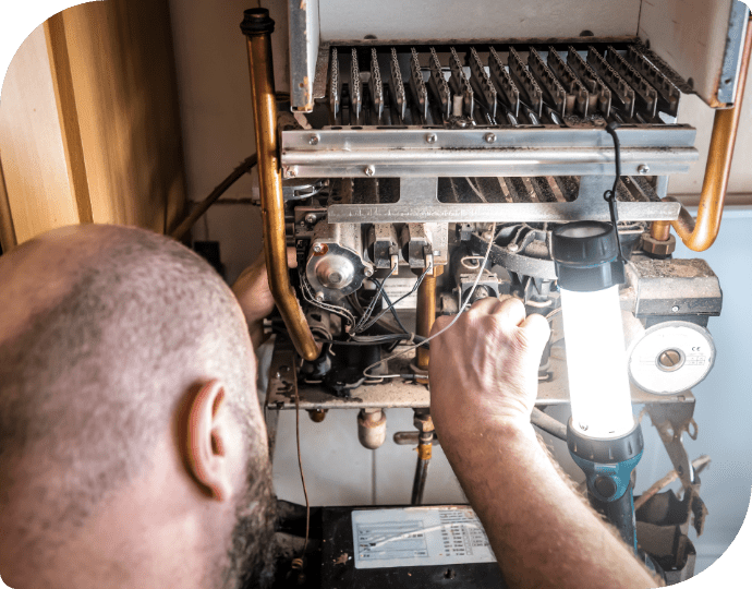 a person working on a gas boiler