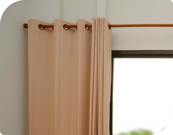 Curtains on a rail with a balcony view