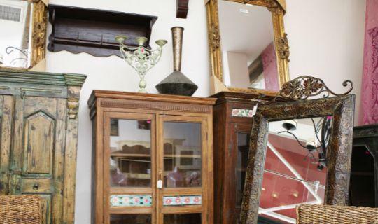 old furniture piled up in a room