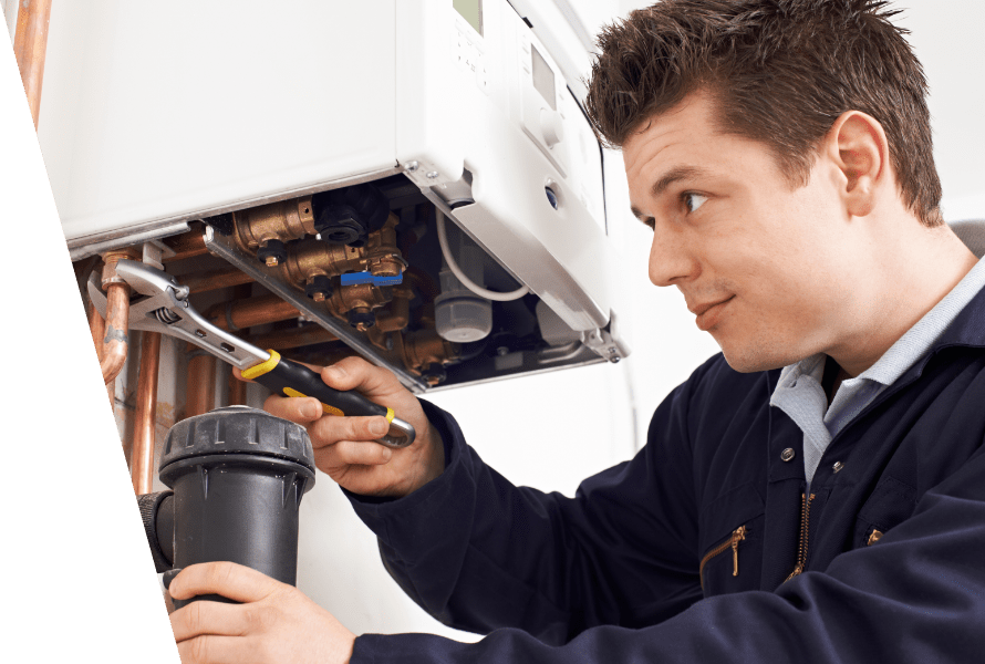 A professional mounting a new boiler