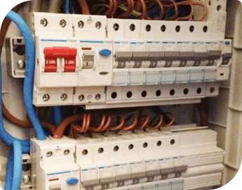 A close-up of an electrical panel with circuit breakers and wiring.