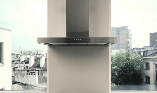 a cooker hood next to a window