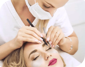 Mobile eyelash technician applies lash extension to a woman