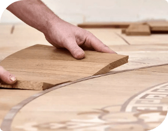 Wood floor fitter during a service