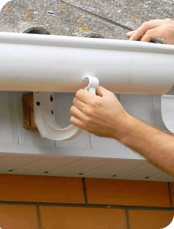 Picture of the hand of a professional technician who is installing a gutter
