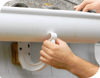 Picture of the hand of a professional technician who is installing a gutter