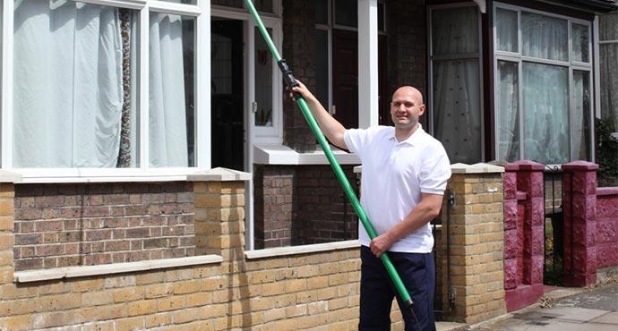 Close-up of a professional window cleaner during a service