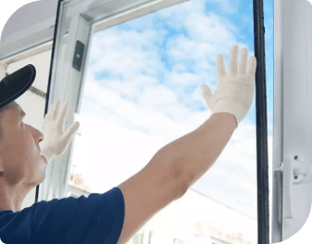 A repair professionals replacing a window glass