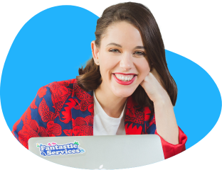 smiley woman using laptop with fantastic services logo
