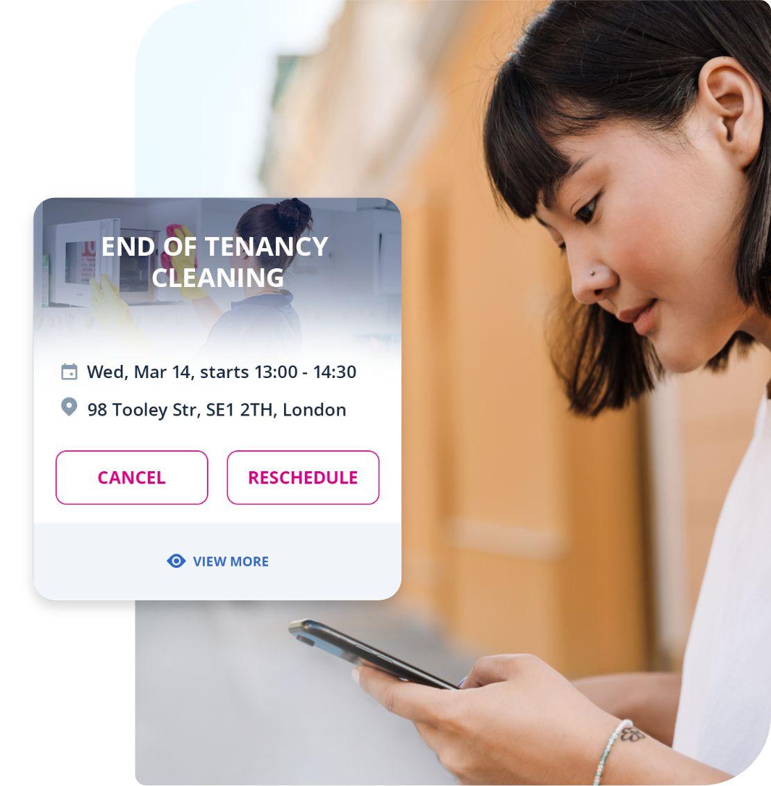 An image of a woman using the GoFantastic mobile app to book end of tenancy cleaning services. The woman is seen holding her smartphone and interacting with the app, selecting the end of tenancy cleaning service from the options provided. She appears focused and engaged in the app, indicating her intent to book the service. The app interface is displayed on the screen, showing the various features and options for booking the cleaning service.