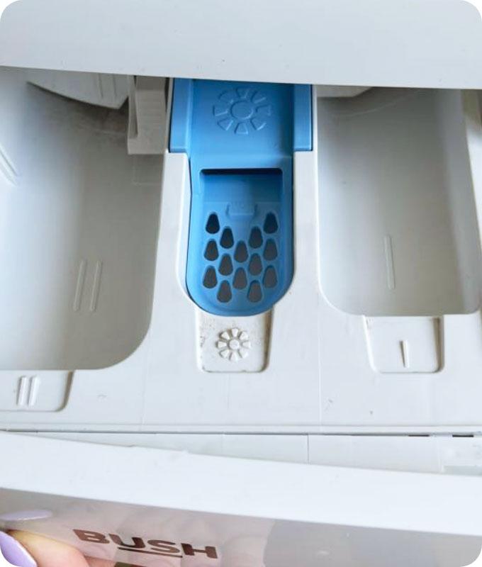 An image of a sparkling clean dishwasher detergent compartment, showing a pristine and well-maintained appearance. The compartment is free from any visible residue, grime, or buildup, and the surface is sparkling clean. The detergent compartment looks fresh and ready for use, with no signs of dirt or debris. The compartment's cleanliness ensures optimal performance and efficiency of the dishwasher.