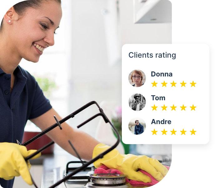 A professional cleaner wearing yellow latex gloves and a dark blue uniform of Fantastic Services. The cleaner is wiping the top of a domestic oven with a cloth and detergent at a brightly lit house kitchen. The is edited to include ratings from customers, showing 3 customers who have given the service a 5-star rating.