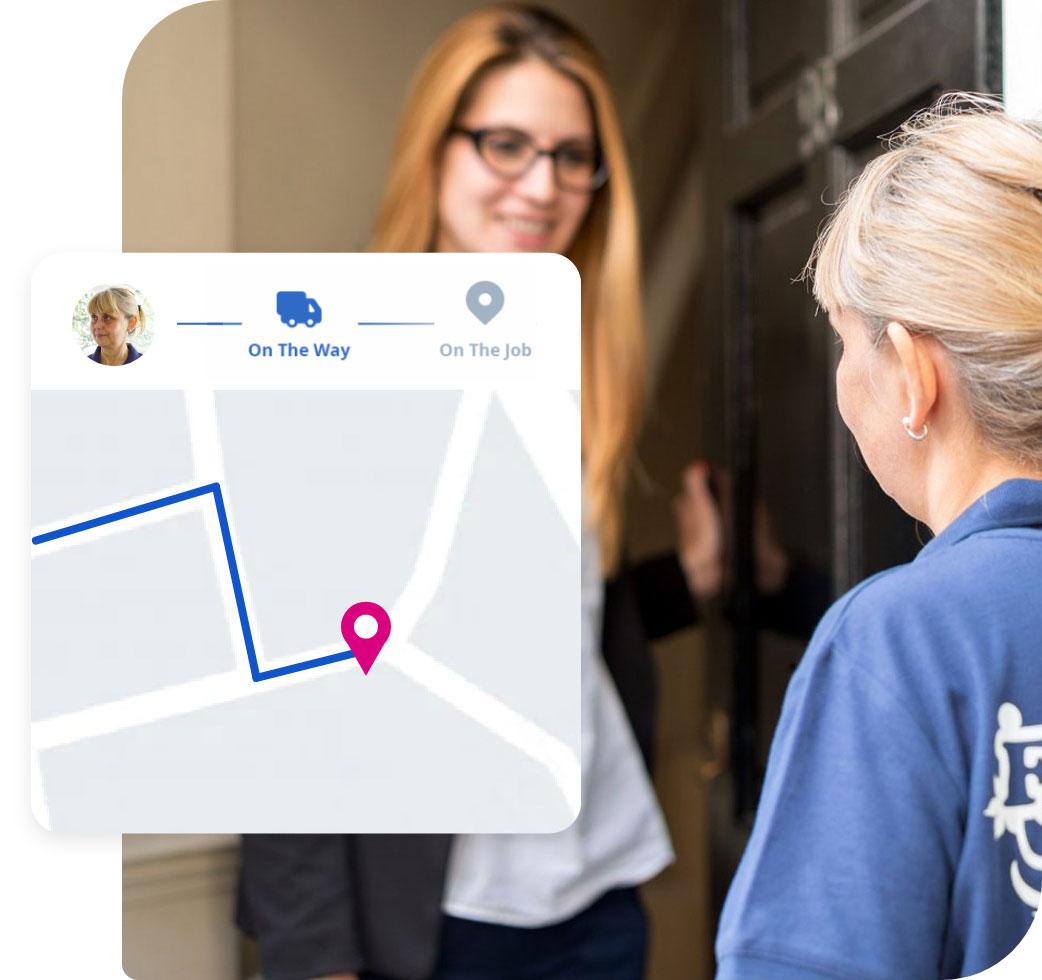 Cleaner and client warmly greet each other in front of a building entrance, with the client holding the door open for the cleaner.