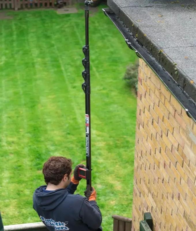 Gutter cleaner using modern equipment to check the gutters