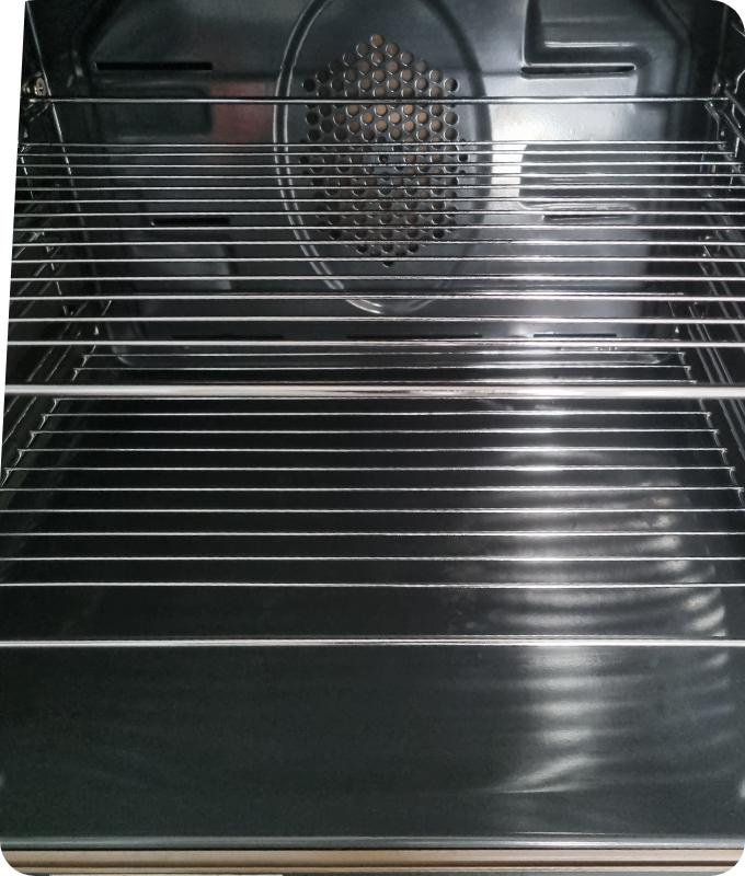 The image shows the same oven chamber on the inside. It appears that the chamber has been thoroughly cleaned and polished. The surfaces look shiny and polished, almost as if the appliance has never been used before.
