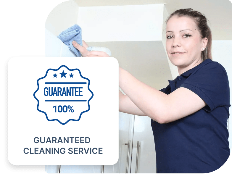 Professional cleaner on a ladder cleaning a cooker hood