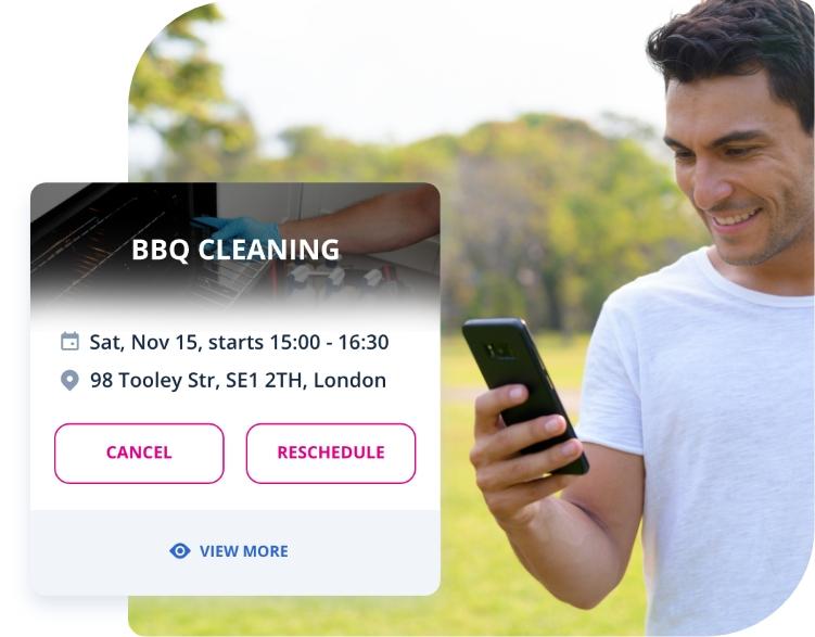 The image shows a Fantastic Services customer who is using their smartphone to book our BBQ cleaning service.