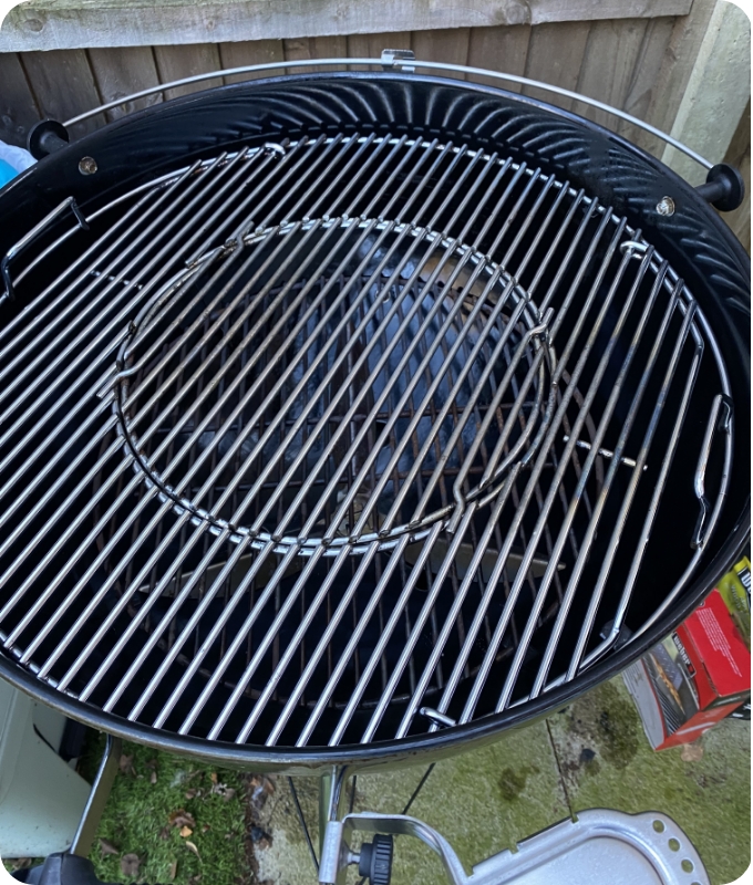 The image shows the same round-shaped barbeque after professional cleaning. It is free of burnt on grease and gunk, and it looks quite shiny.