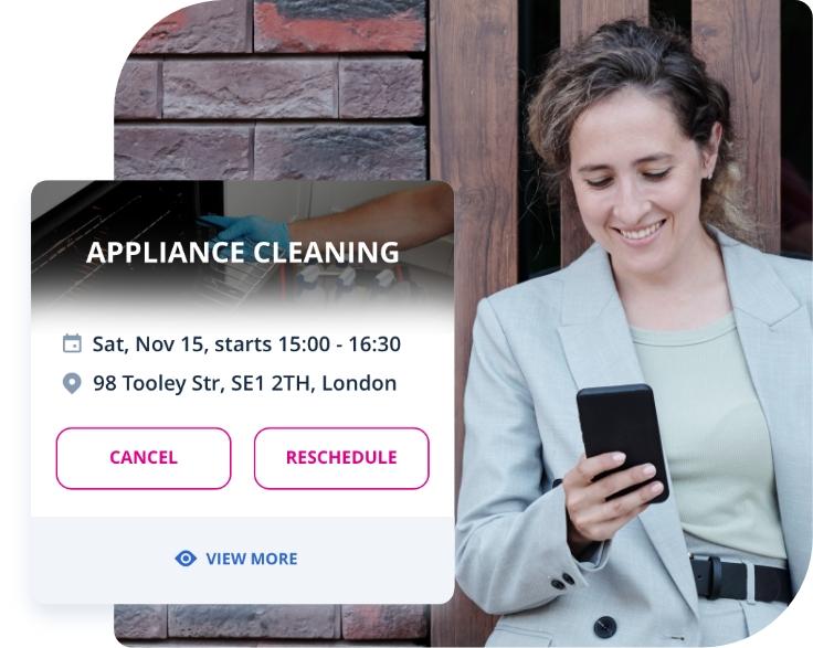 The image shows a Fantastic Services customer who is using their smartphone to book an appliance cleaning service.