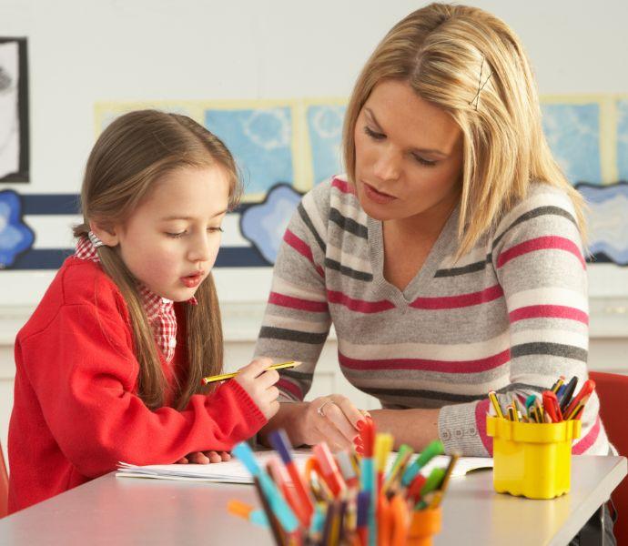 Female tutor teaching a young student
