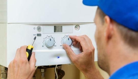 a professional working on fixing a boiler