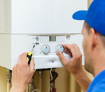 a man working on a gas boiler