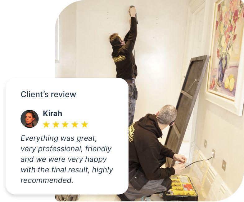 Fantastic handymen hanging a mirror