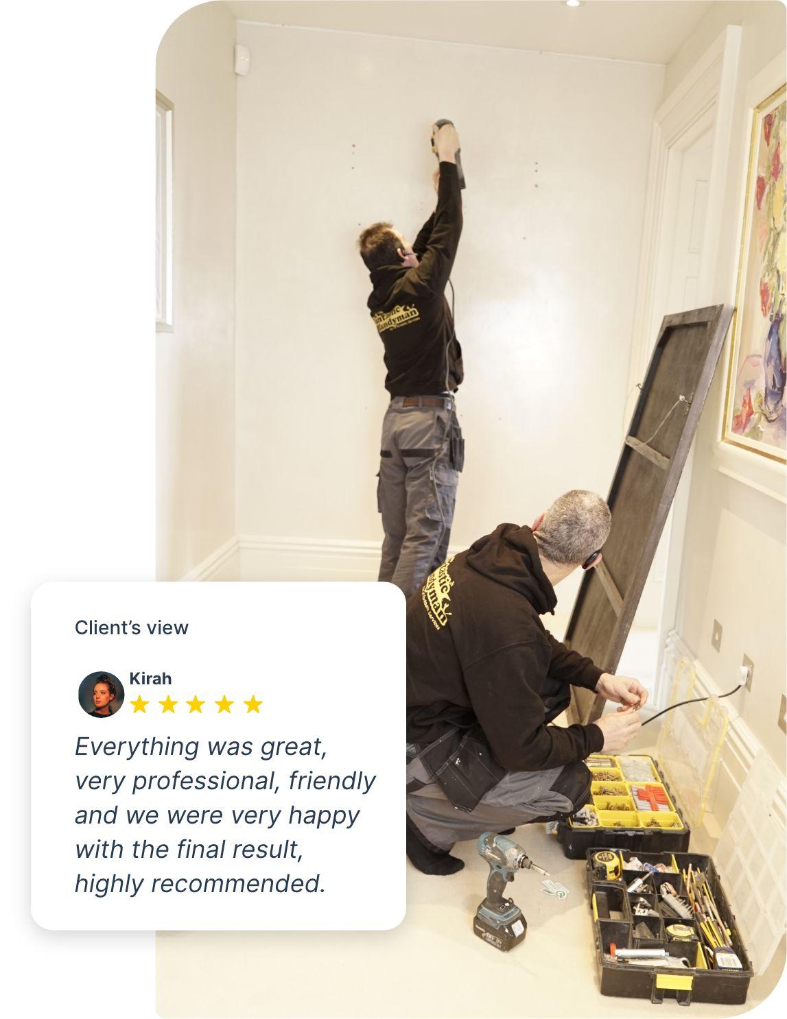 Fantastic handymen hanging a mirror