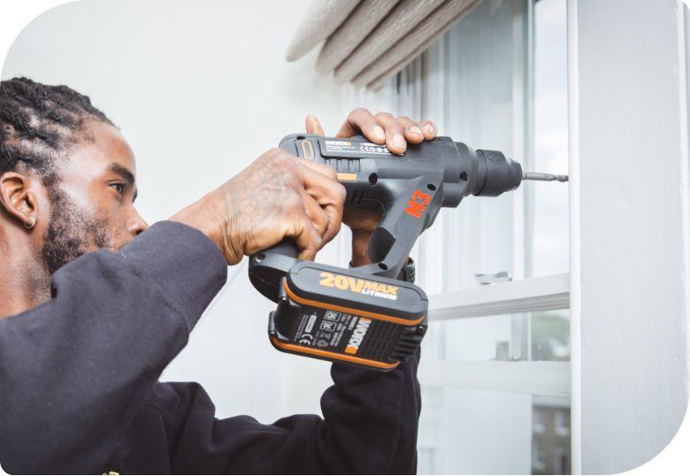 Handyman installing blinds