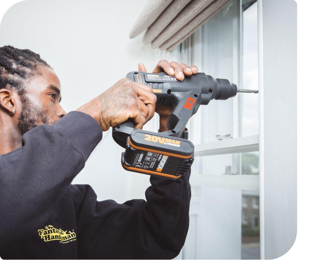 Handyman installing blinds